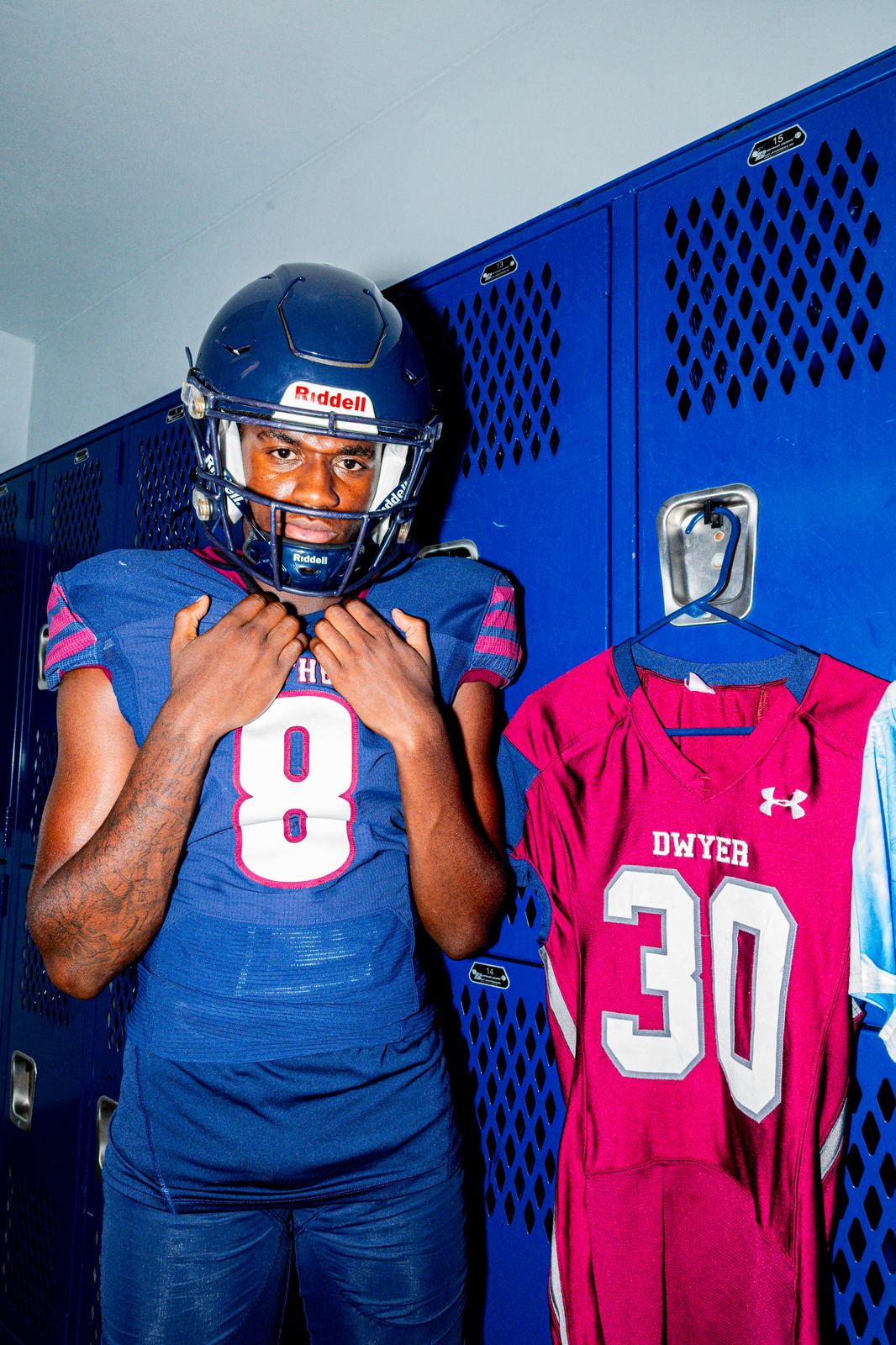High school athlete suiting up in the locker room
